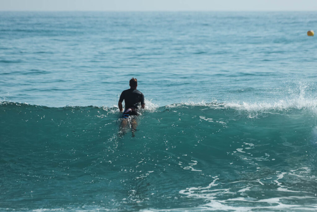 EOSR7633 "Surfer catching a wave in Taghazout, Morocco during an all-inclusive surf trip."